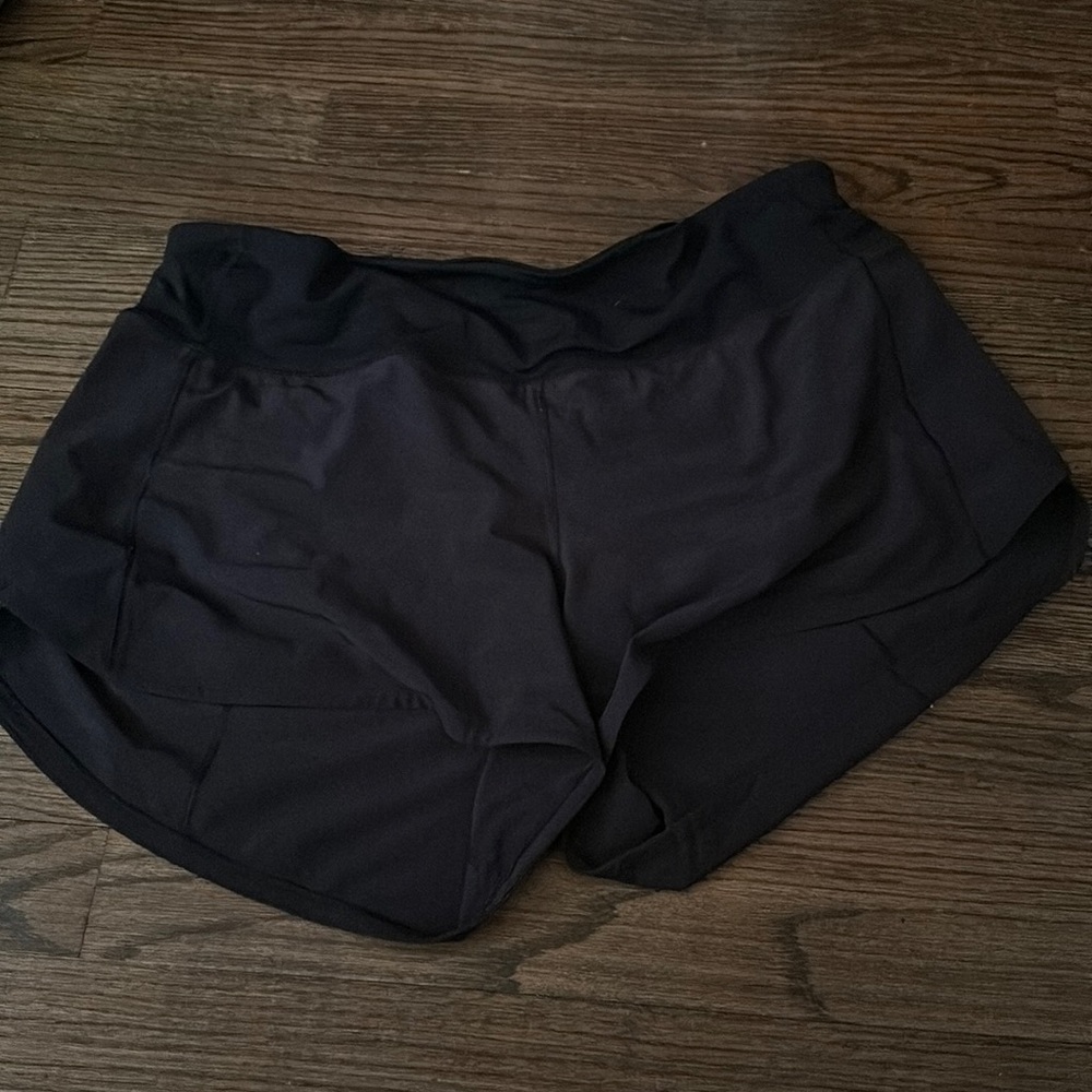 black lululemon speed up low rise 4’ shorts